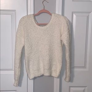 White fuzzy sweater.